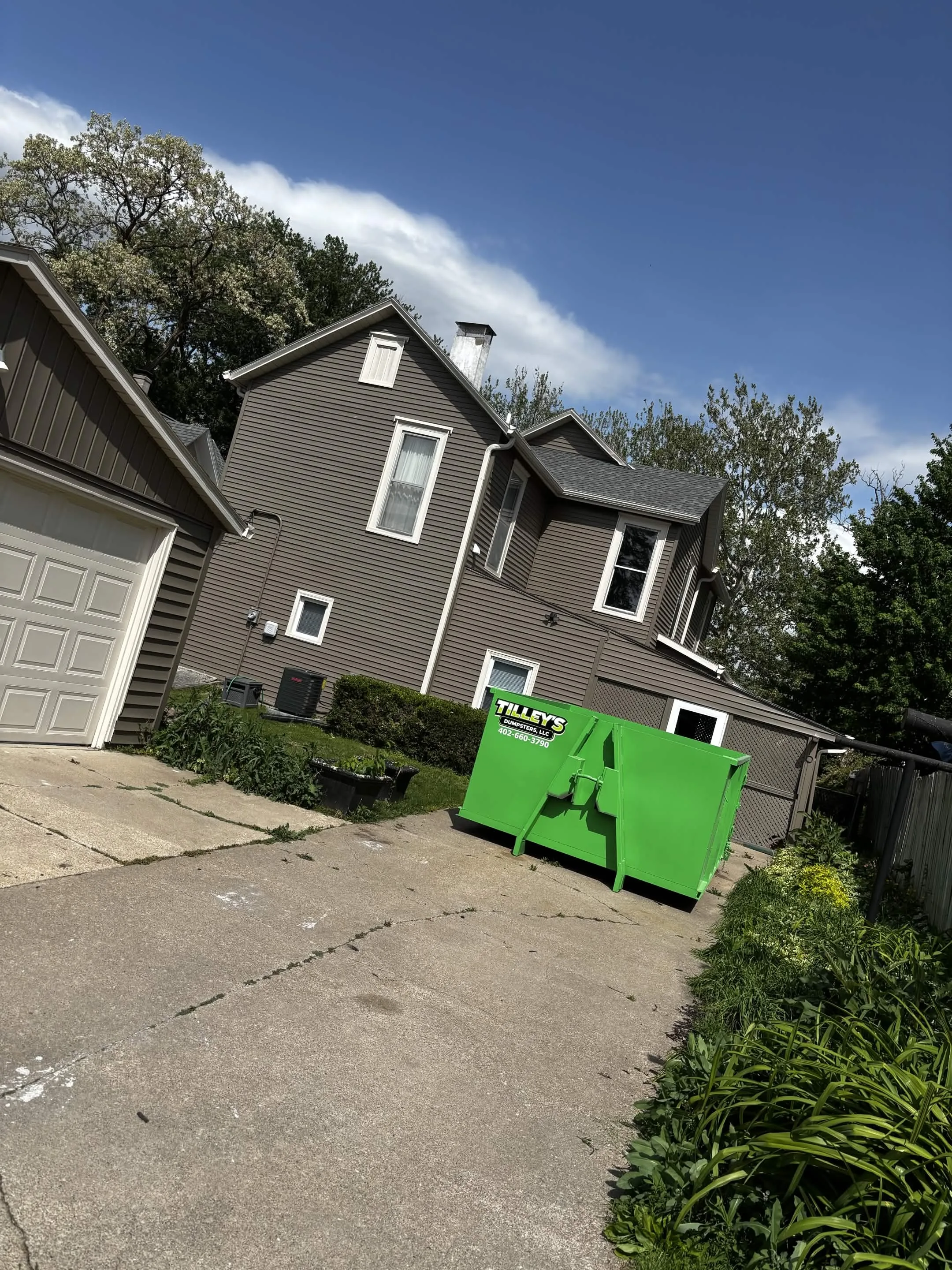 Tilley's dumpster placed in a residential driveway