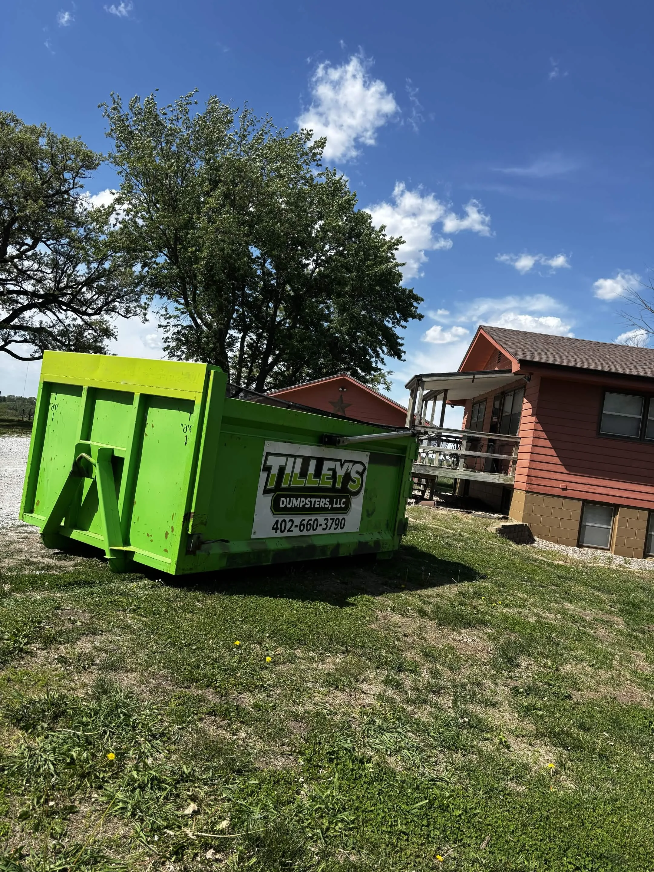 Tilley's dumpster on a rural property