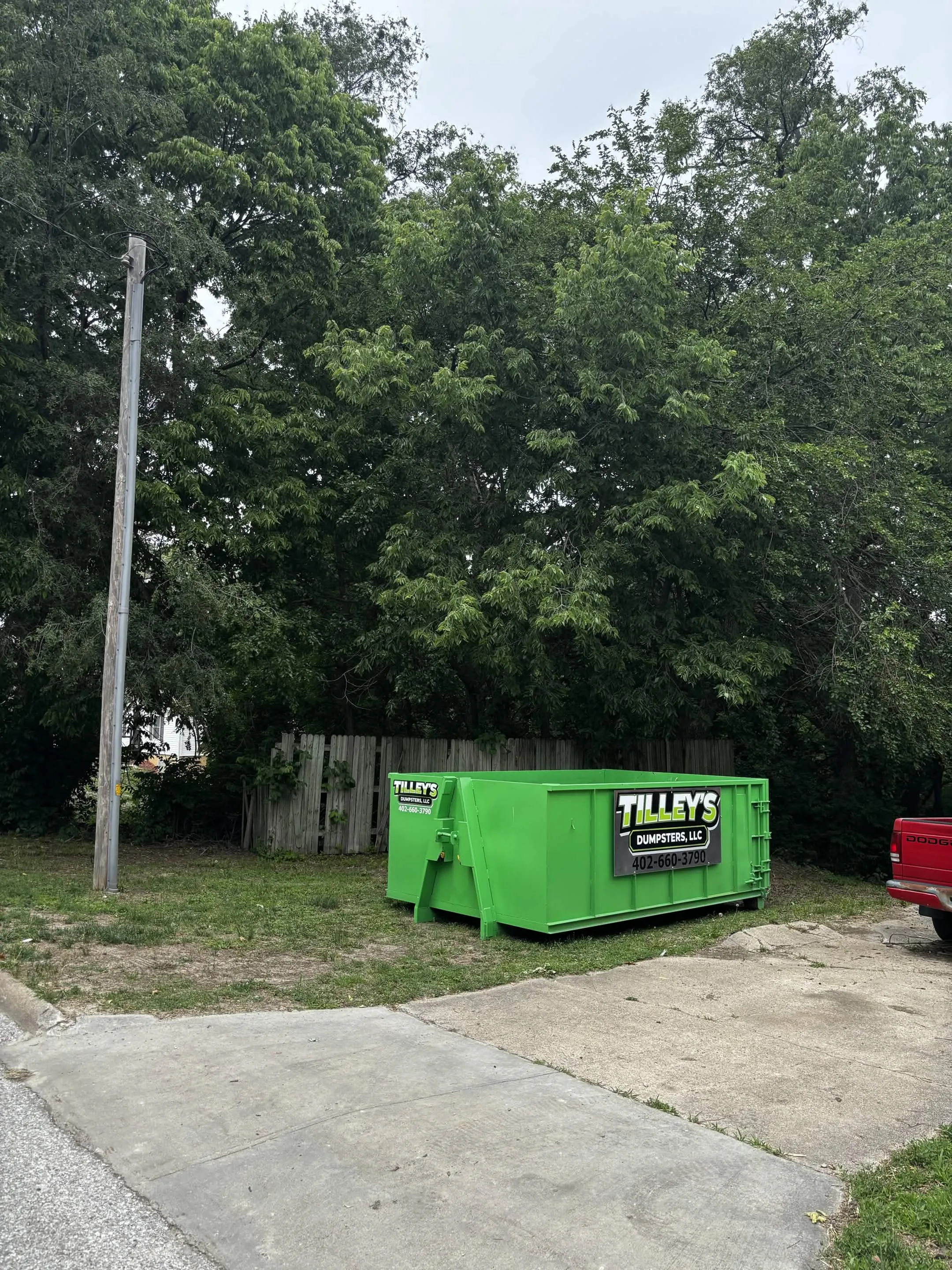 Tilley's dumpster on a vacant lot