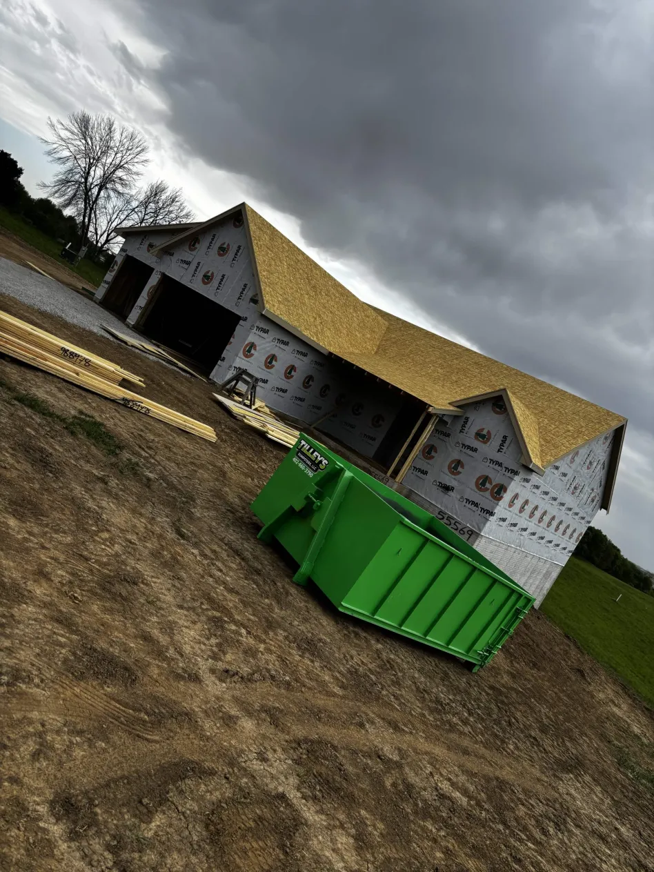 15 yard Tilley's dumpster at a construction site
